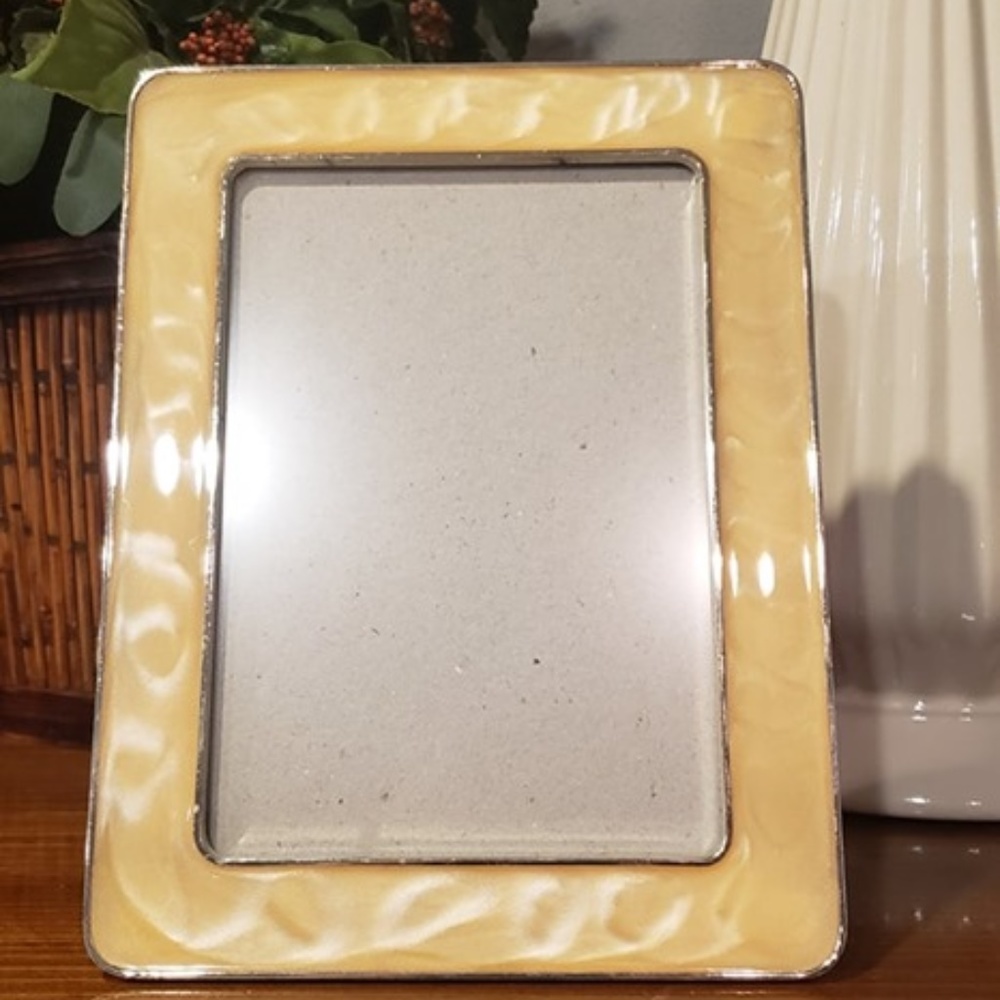 Vintage mother of pearl and silver picture frame holds a 5x7 picture
